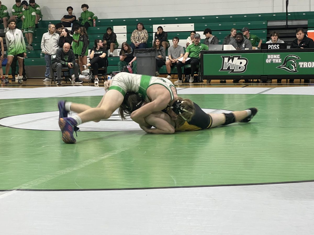 A West Brunswick Junior Varsity Wrestler pins a Topsail opponent.