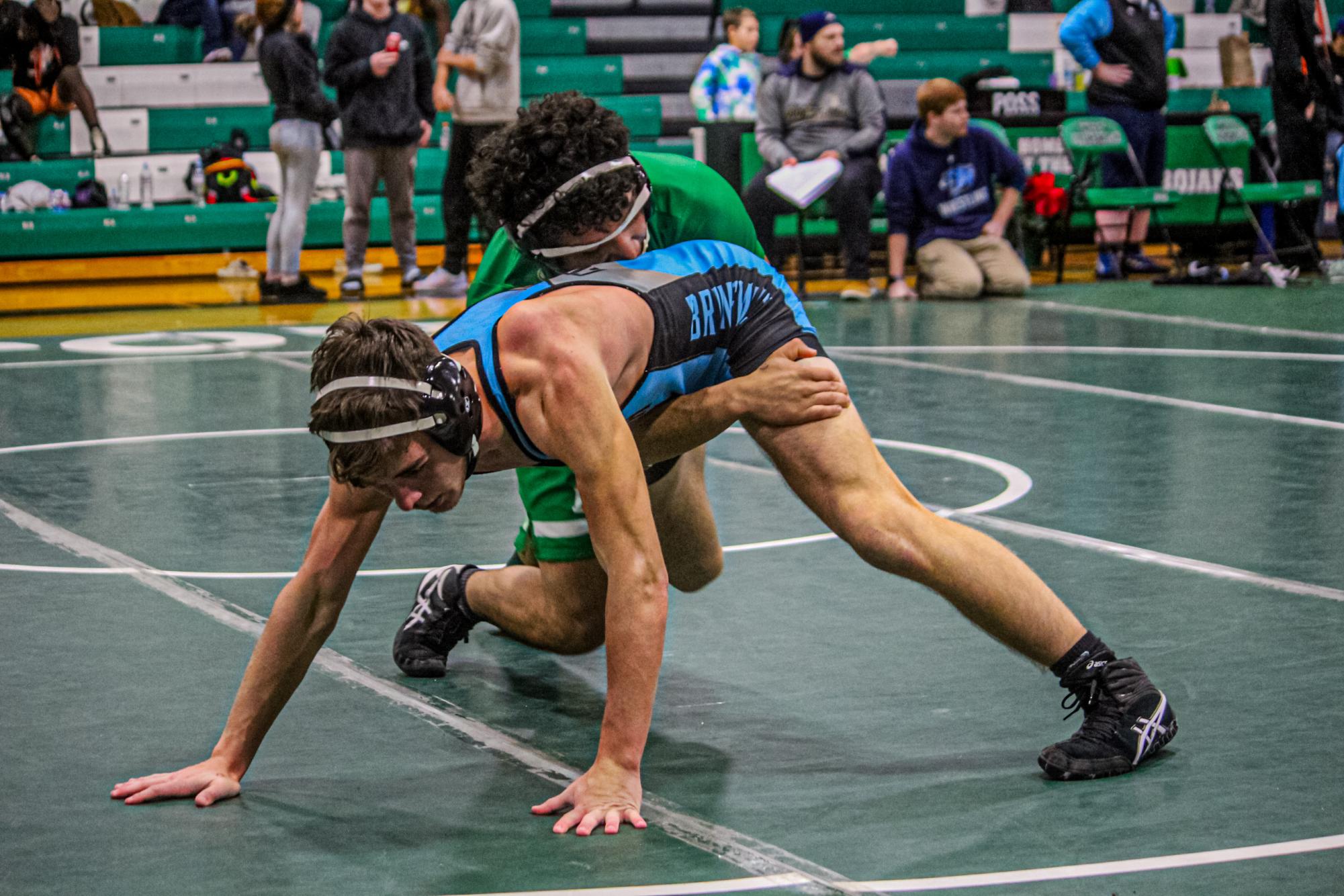 Senior Leonel Rodriguez fought hard against his South opponent, shortly before cutting his head open pausing the match, then the trainer coming to clean him. 