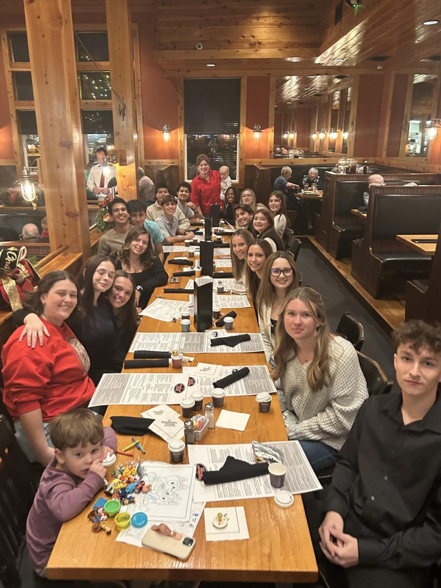 Group photo of the West Wind shortly after finding their seats in the restaurant. 