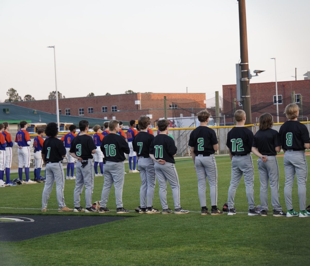 Part of the JV team on the field for the National Anthem. 