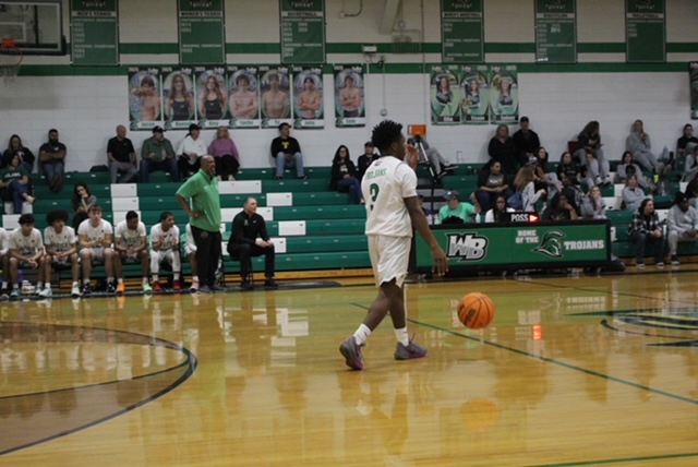 Sophomore Motashi Lance, dribbling the ball up the court 