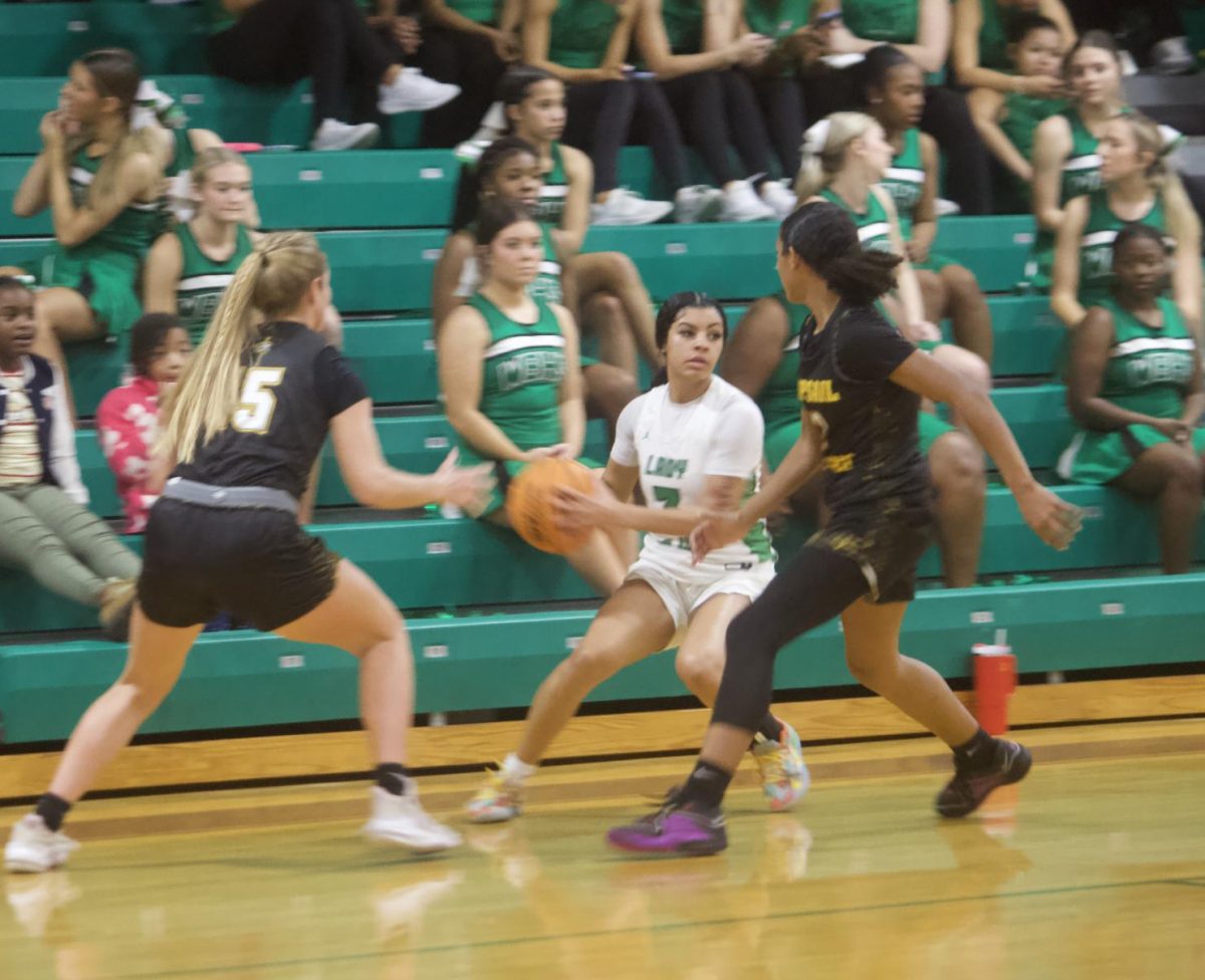 Senior JaHyra Mastry looking to pass the ball to her teammate.