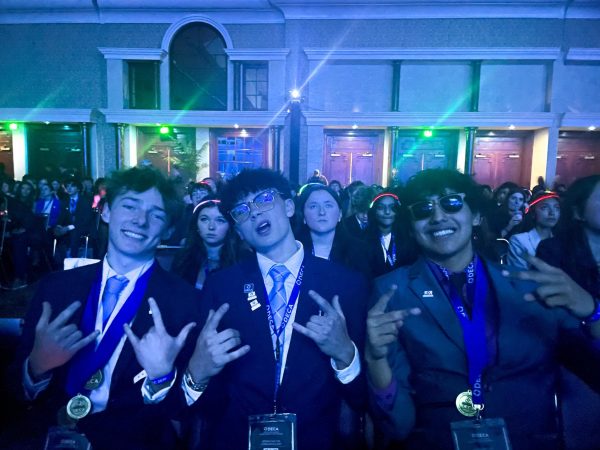 Junior's Kyle Mccoy, Tucker Hamilton, and senior Heriberto Vargas sitting at the awards ceremony hoping to win that class. In which they later found out they did winning first and second place. 