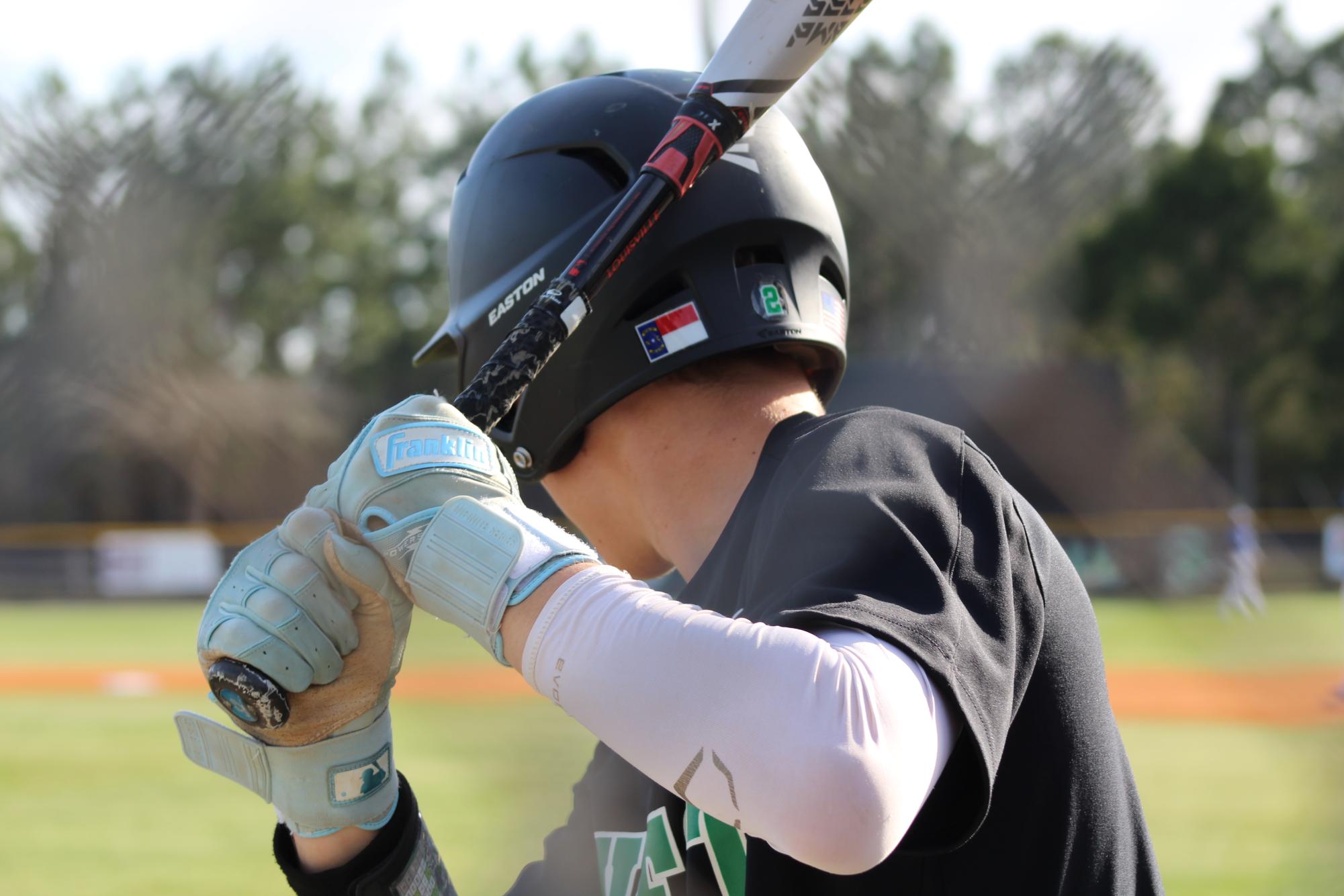 Sophomore Wesley Wilson practicing before going up to hit. 