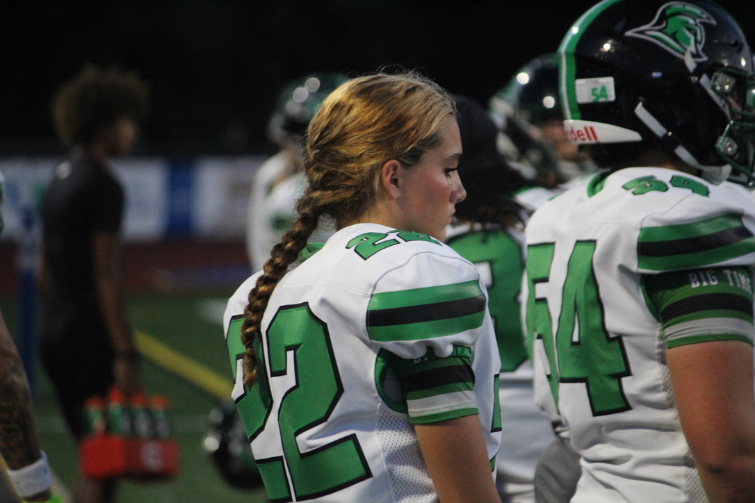 Senior Madison Richardson watching the game from the sidelines.