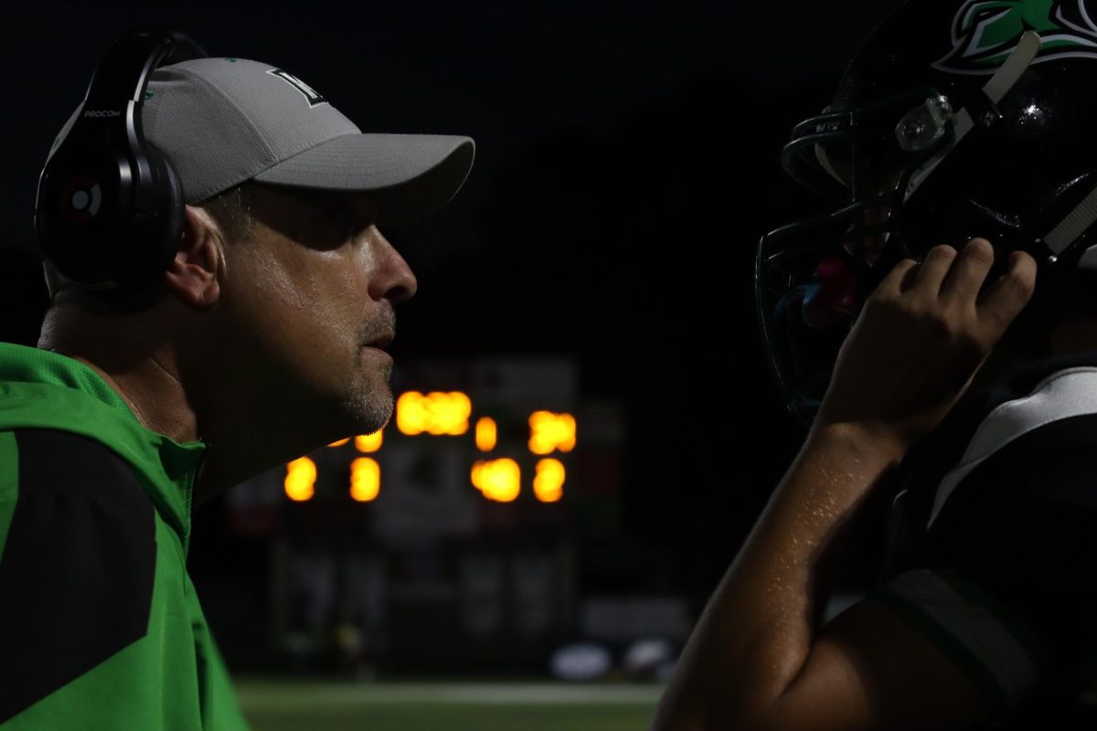 Coach Handy talking to quarter back Josiah Borton