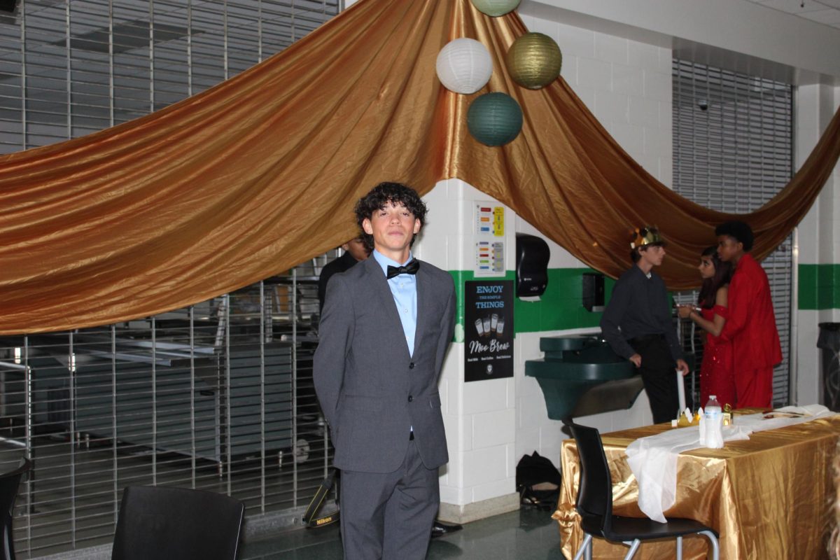 Senior Jonathan Whitt posed on the side of  the dance floor.