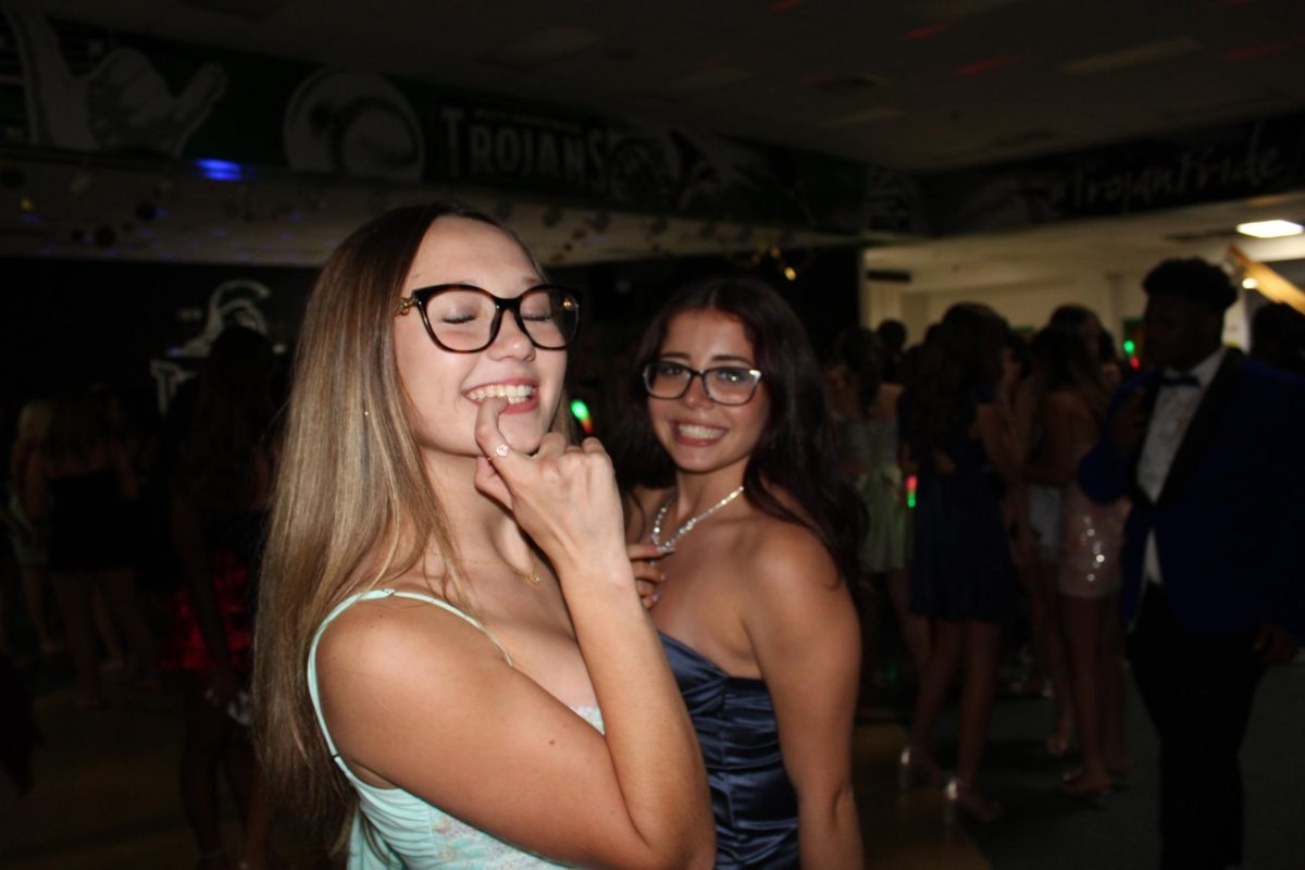 Juniors Ashlyn Childers and Luma Rosa smiling on the dance floor. 