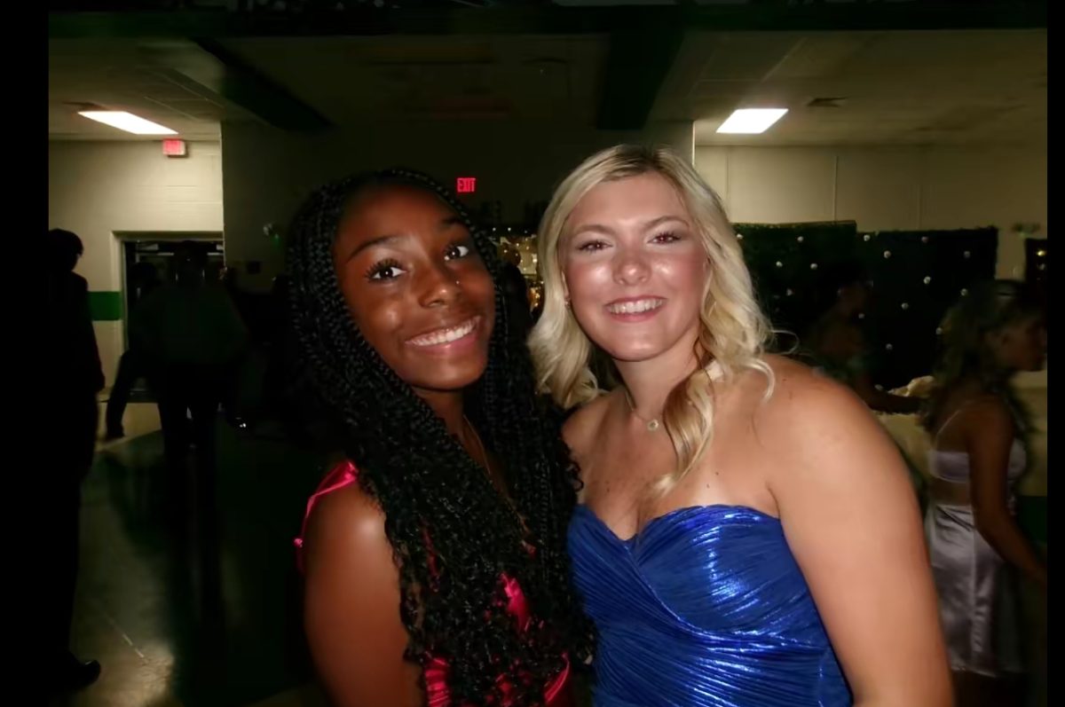Freshman Zoei King and junior Aubrey Brown smiling for their picture. 