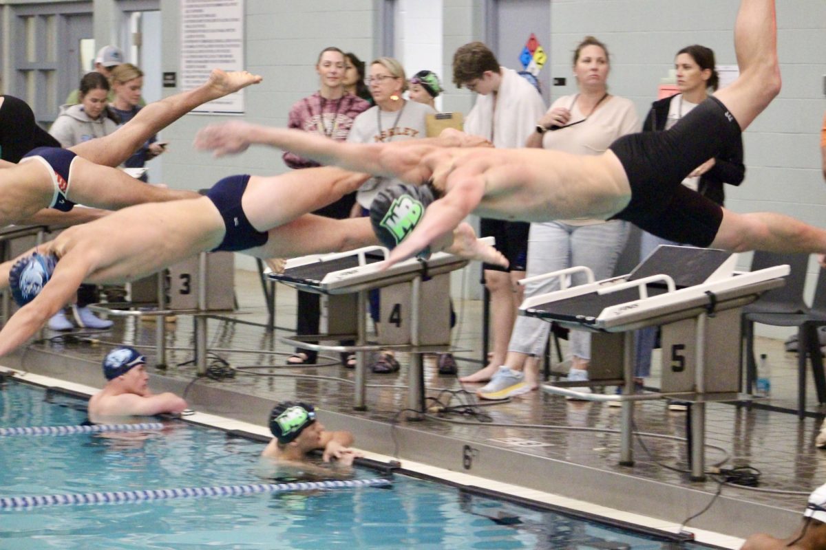 Senior Tucker Hamilton diving into a race.