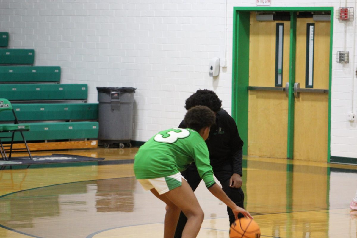 The JV Women's team warming up before the game starts.