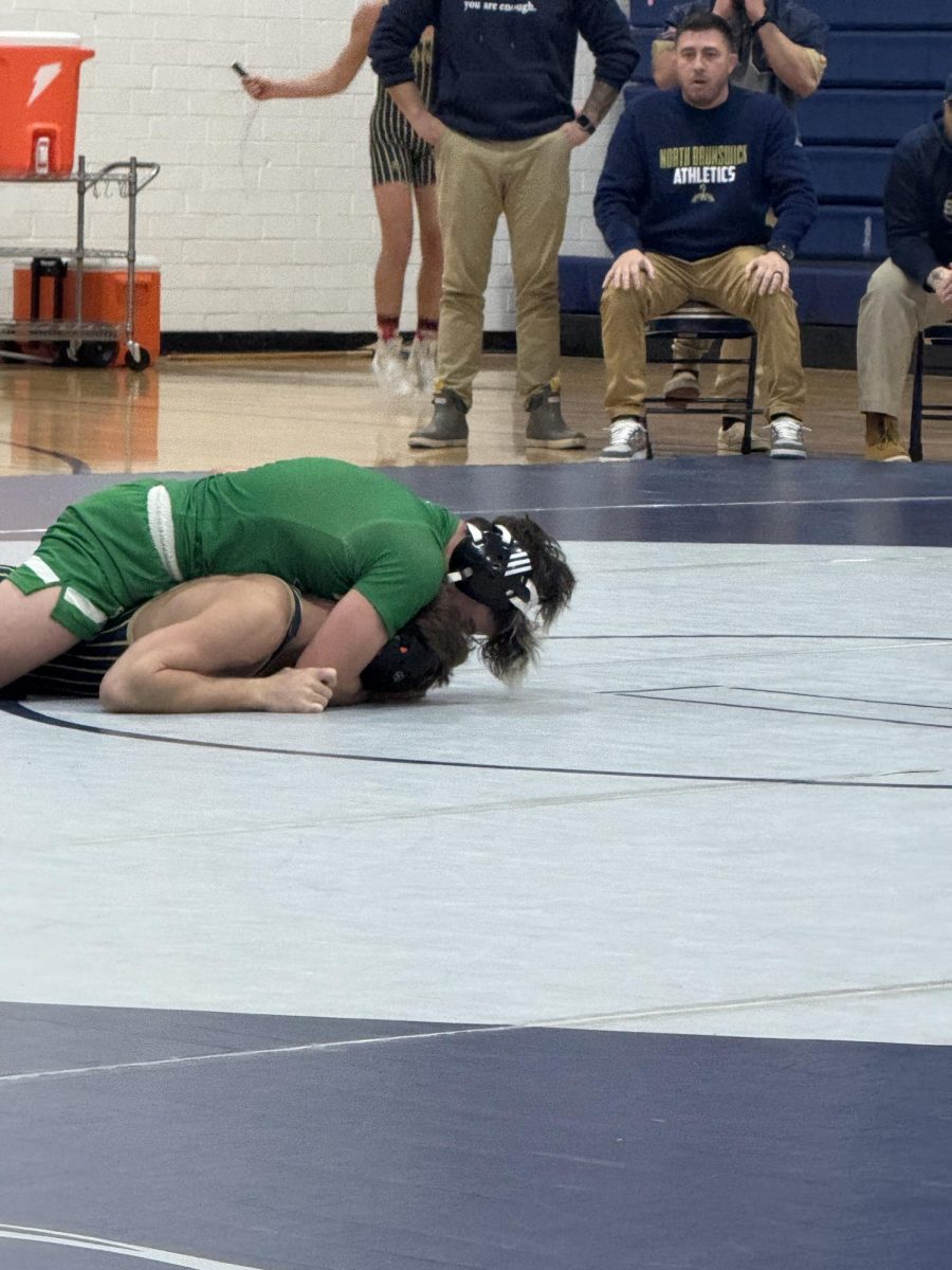 Varsity player locking down on opponent.