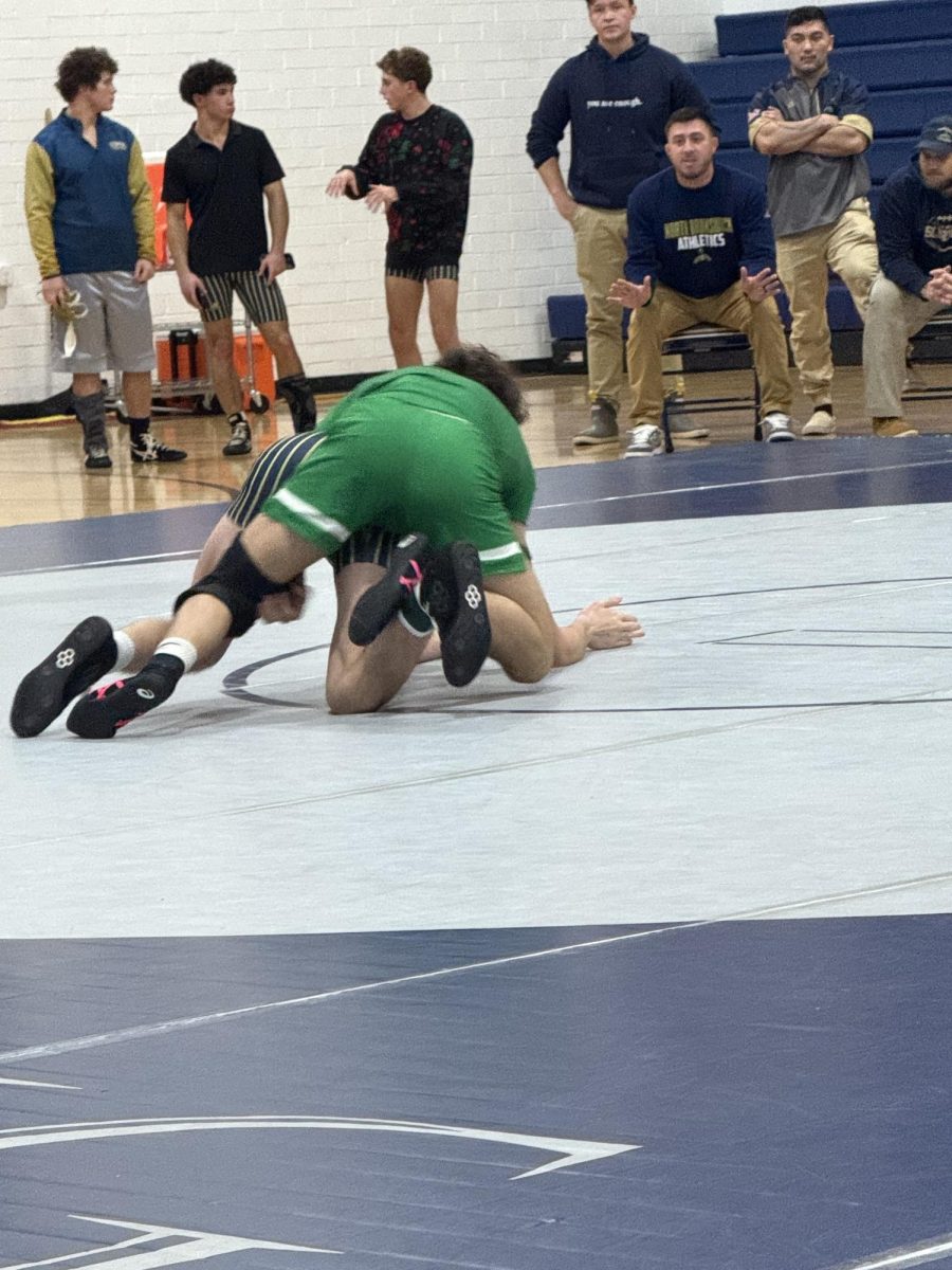 varsity player on the take down.