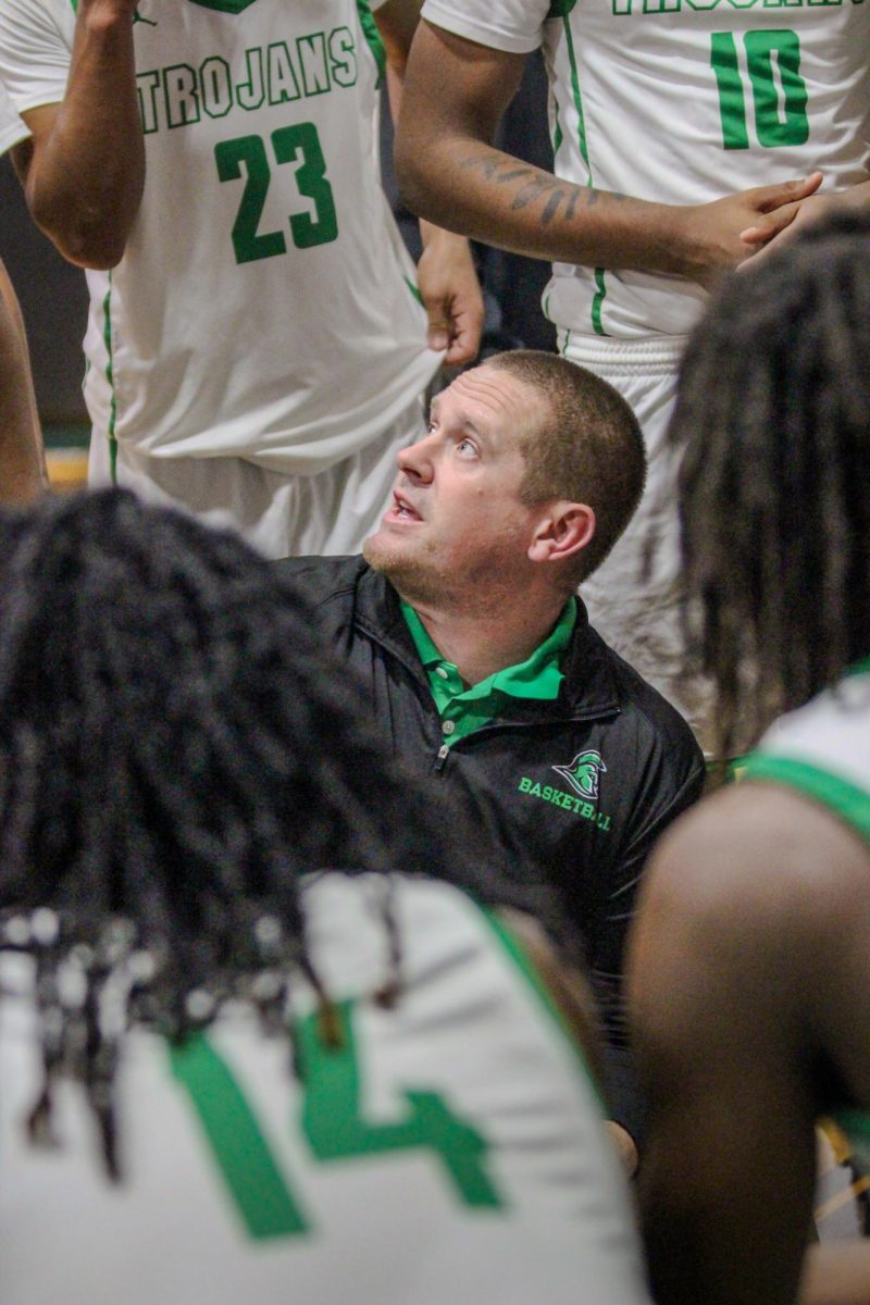 Head coach Edwards talks to his players before the fourth and final quarter begins. 