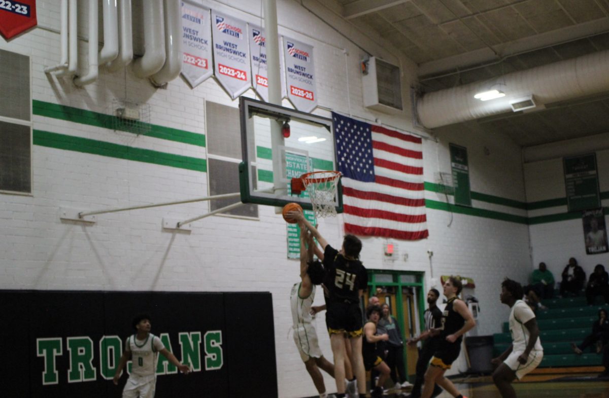 The Trojans hustling to the net.