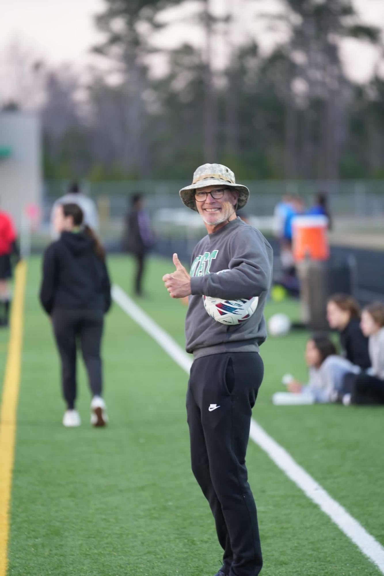 Adcock giving a thumbs up during a game, showing his eagerness and big smile. 