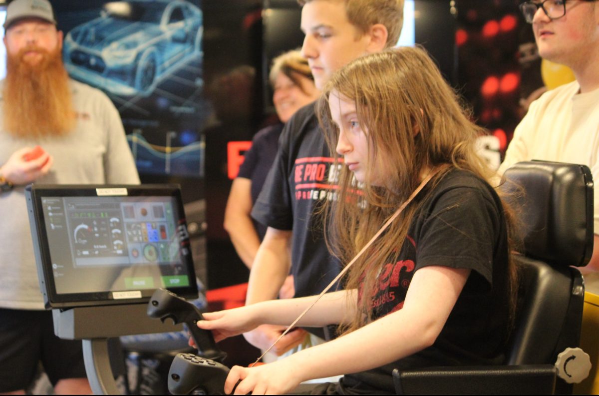 student focused on using the forwarder simulator.